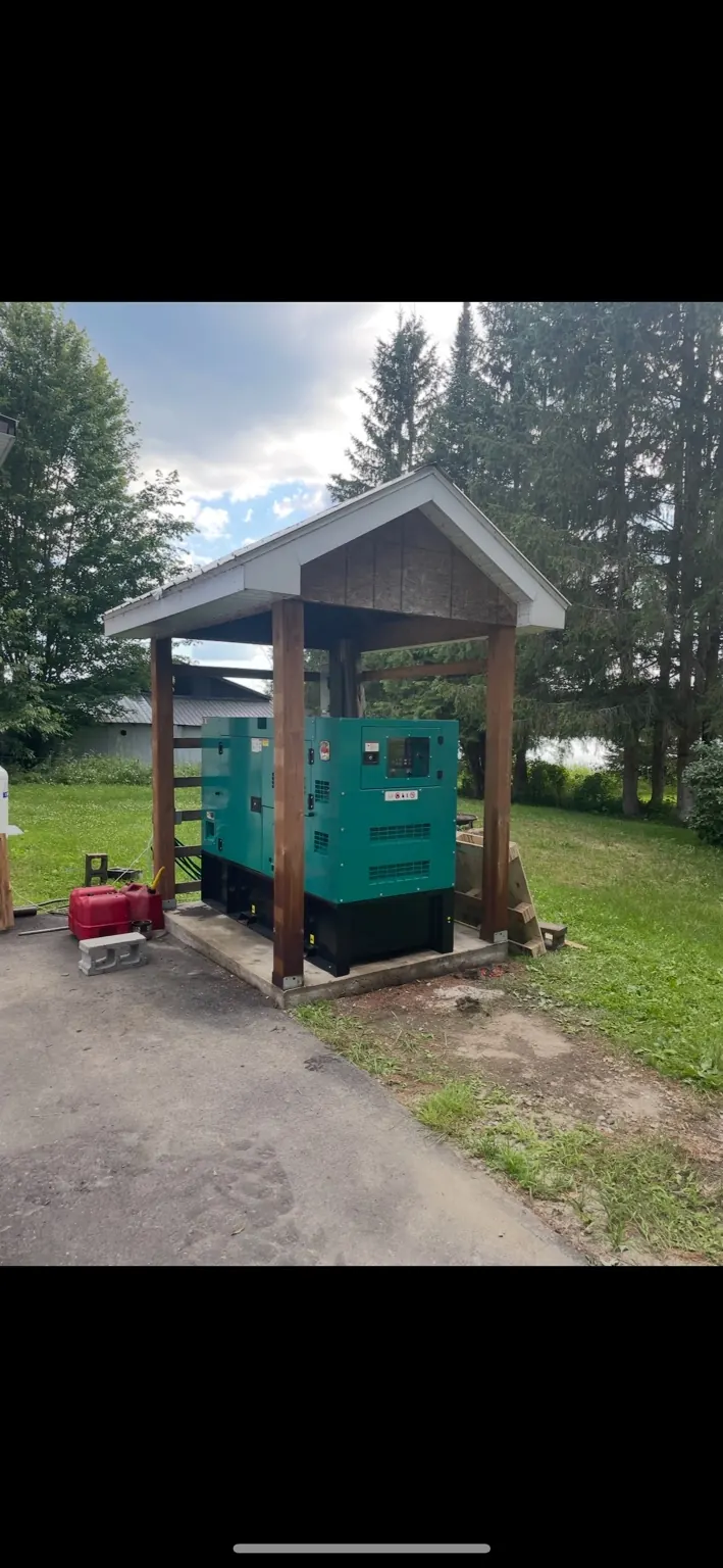 Diesel generator installed under an outdoor shelter